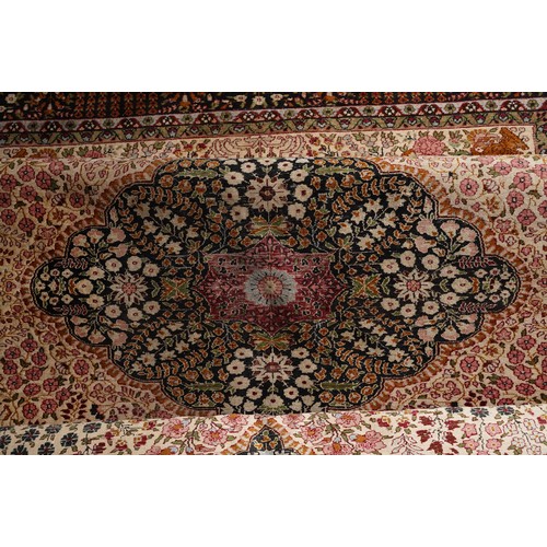 867 - A Turkish Silk rug in brown tones  180 X 254