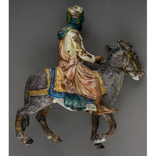 879 - An early 20th Century cold painted bronze figure of a man and a donkey in the manner of Franz Xavier... 