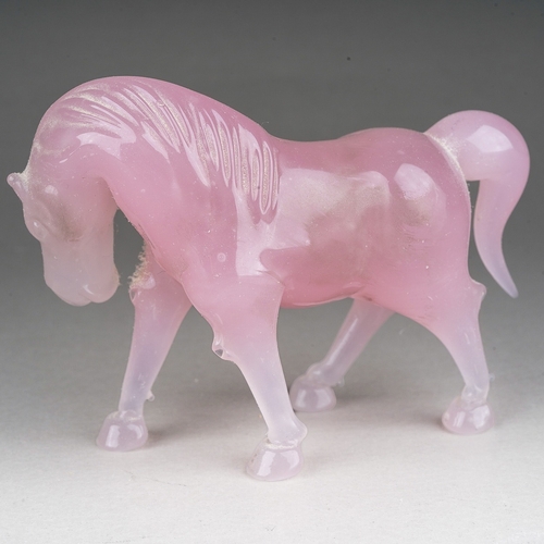 884 - A Peking pink opaque glass model of a horse, approx 8cm wide overall