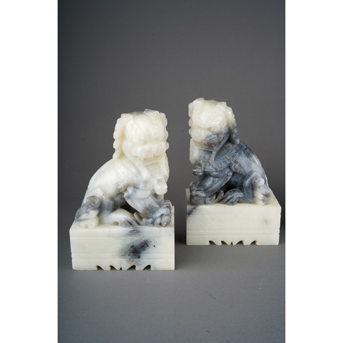 885 - Two pairs of 20th century carved soapstone figures, comprising a pair of horses and a pair of seated... 