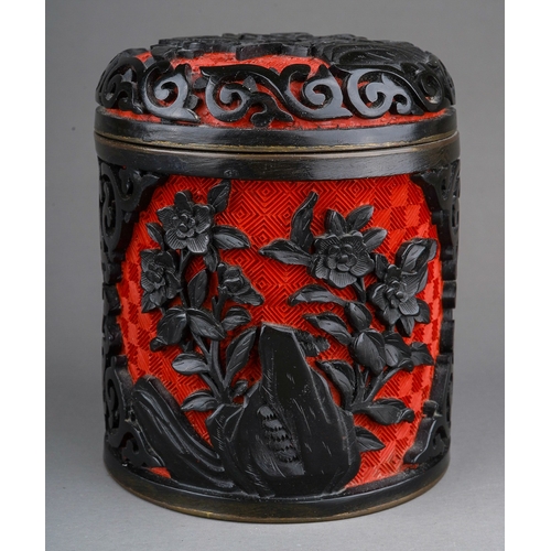 887 - A 20th century Chinese enamel land lacquer cylindrical box and cover with floral relief decoration, ... 