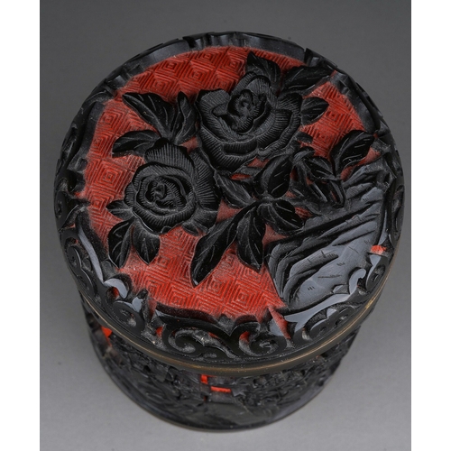 887 - A 20th century Chinese enamel land lacquer cylindrical box and cover with floral relief decoration, ... 