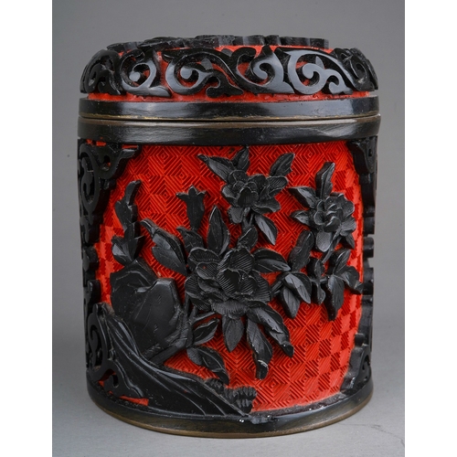 887 - A 20th century Chinese enamel land lacquer cylindrical box and cover with floral relief decoration, ... 