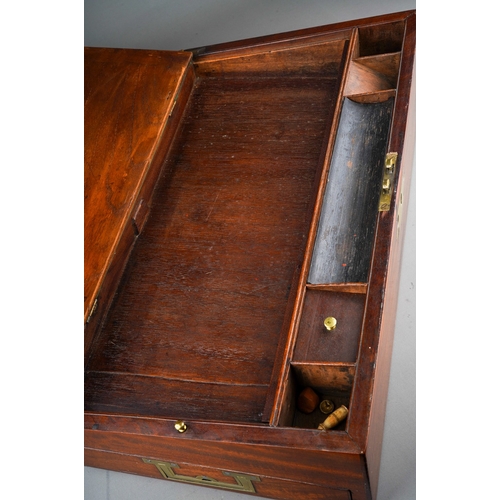 888 - A Victorian mahogany writing slope, brass cartouche inset to hinged cover and brass escutcheon, and ... 