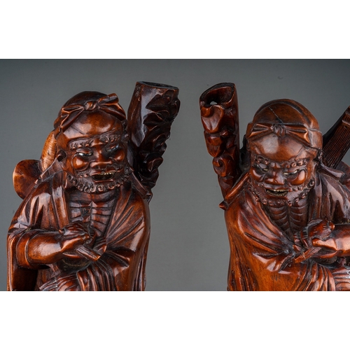 890 - Pair of 19th Century  Chinese hardwood carvings of elderly men with bone inlay detailing, approx. 42... 