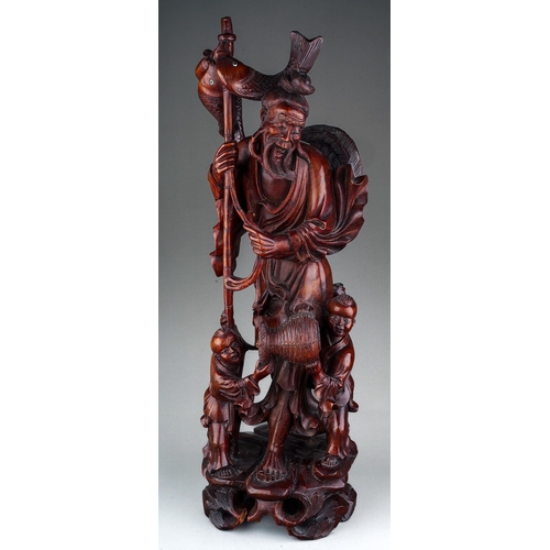 891 - Chinese Hardwood Carving of an elderly with 2 children by his feet helping him, 19th century.  With ... 