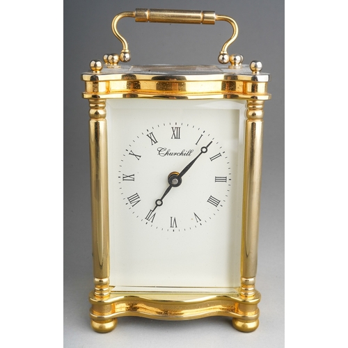 962 - A Churchill brass carriage clock, white dial with Roman numerals, approx 11cm high, boxed with key