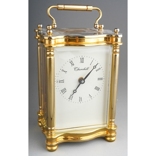 962 - A Churchill brass carriage clock, white dial with Roman numerals, approx 11cm high, boxed with key