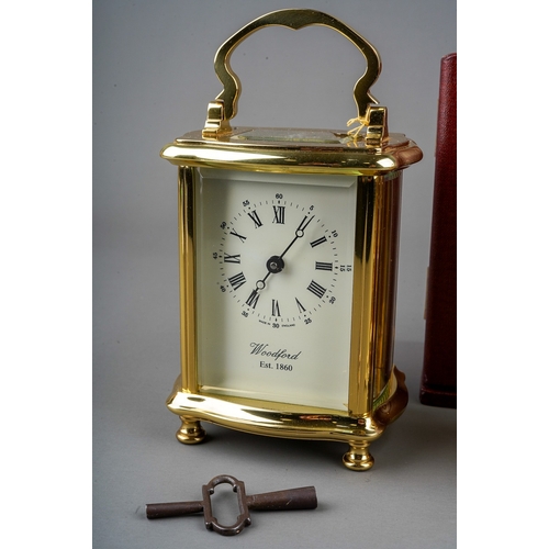 966 - Two brass cased carriage clocks retailed by Woodford one with travel case. (2) keys in boxes.