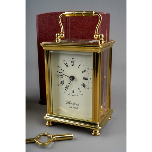 966 - Two brass cased carriage clocks retailed by Woodford one with travel case. (2) keys in boxes.