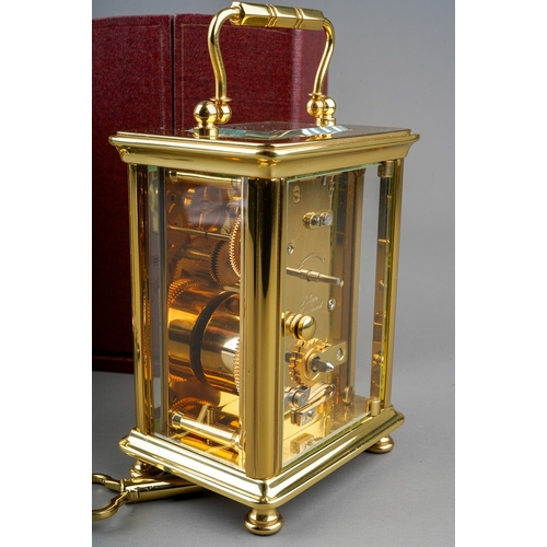 966 - Two brass cased carriage clocks retailed by Woodford one with travel case. (2) keys in boxes.