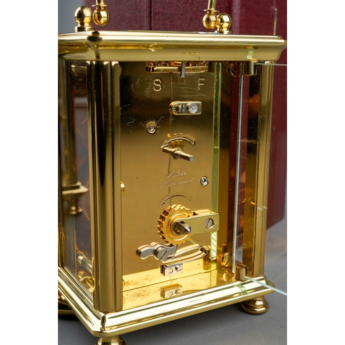 966 - Two brass cased carriage clocks retailed by Woodford one with travel case. (2) keys in boxes.