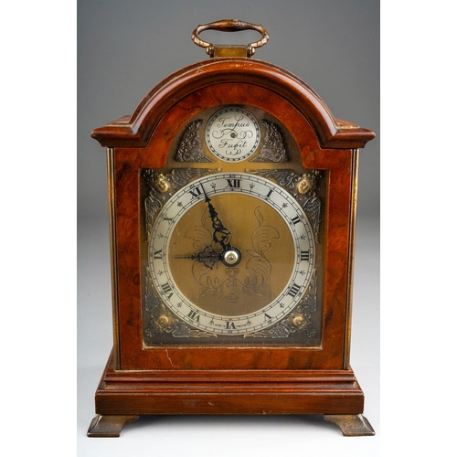 969 - A Modern English simulated walnut mantle clock, brass dial with Roman numerals stamped An Elliot Clo... 