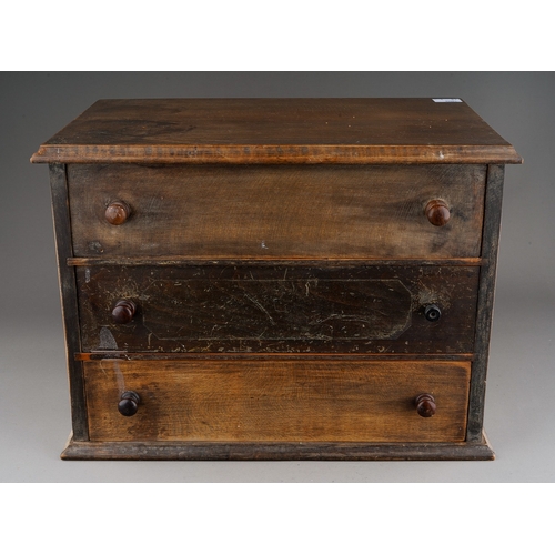 974 - An early 20th Century mahogany table chest of three long drawers with turned handles, on plinth supp... 