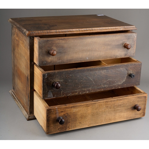 974 - An early 20th Century mahogany table chest of three long drawers with turned handles, on plinth supp... 