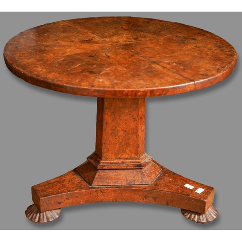 976 - An early Victorian burr oak occasional table, the circular top with eight divisions, on a reduced tr...