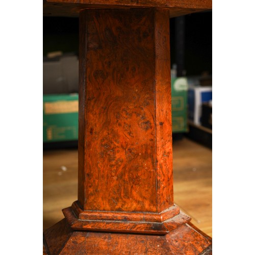 976 - An early Victorian burr oak occasional table, the circular top with eight divisions, on a reduced tr... 