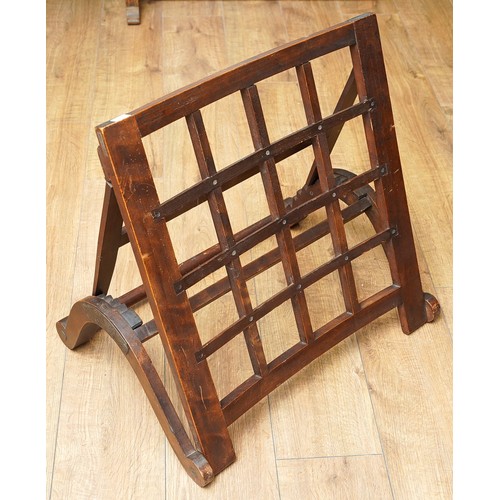 979 - A late 19th century beech and pine campaign folding back rest with arched scroll supporting ratchet ... 