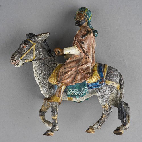 879 - An early 20th Century cold painted bronze figure of a man and a donkey in the manner of Franz Xavier... 