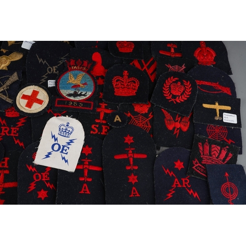 93 - A collection of cloth ERII era Royal Navy Trade and Rank Insignia, some in wire bullion embroidery.