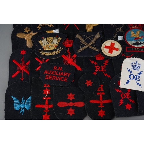 93 - A collection of cloth ERII era Royal Navy Trade and Rank Insignia, some in wire bullion embroidery.