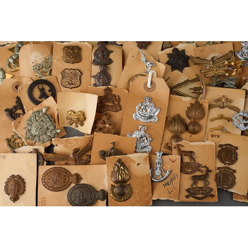 96 - A collection of South African Army Cap badges and collar dogs.