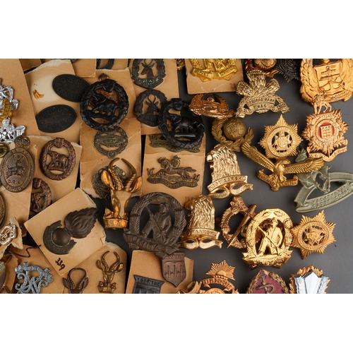 96 - A collection of South African Army Cap badges and collar dogs.