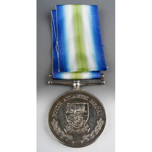 146 - ERII South Atlantic Medal to A/B (R) E Woodhouse, D1695890 RN. Complete with ribbon.