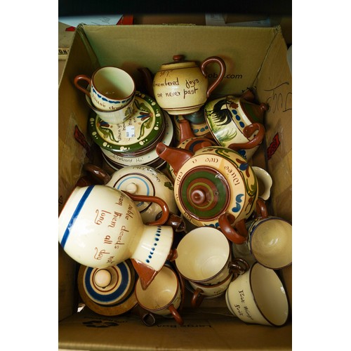 161 - Two boxes of Torquay pottery motto ware, including tea pots, jugs, plates, cups, saucers, hot water ... 