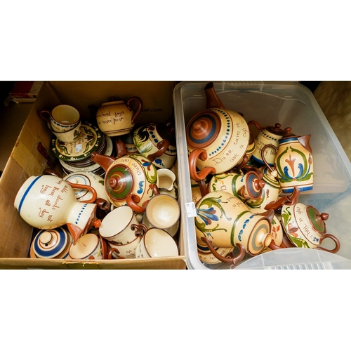 161 - Two boxes of Torquay pottery motto ware, including tea pots, jugs, plates, cups, saucers, hot water ... 