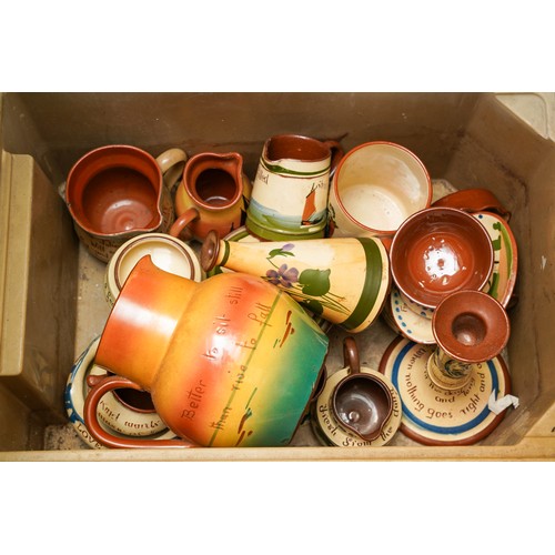 162 - Three boxes of Torquay pottery motto ware, including jugs, hot water jugs, egg cups, perfume flasks,... 