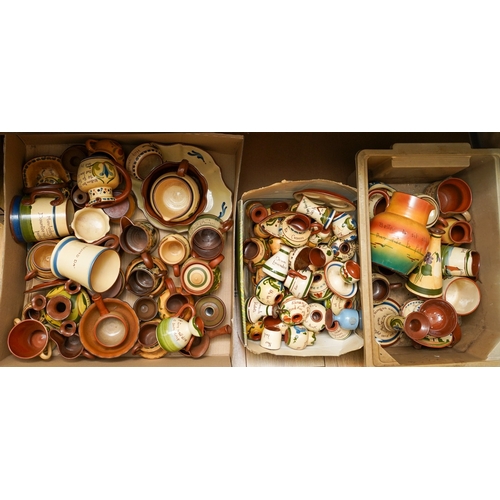 162 - Three boxes of Torquay pottery motto ware, including jugs, hot water jugs, egg cups, perfume flasks,... 