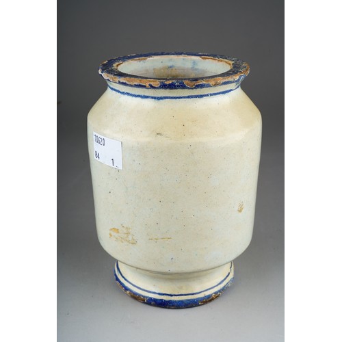 169 - A maiolica glazed pharmacy jar, painted with crest to the front, glaze losses to rims, height 14cm, ... 