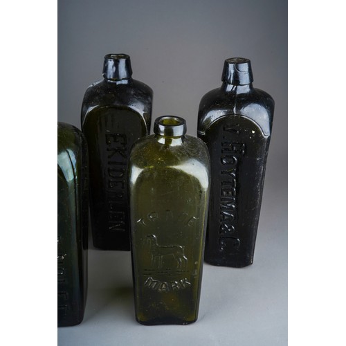 174 - A collection of nine 18th and 19th century green and brown glass bottles, six of tapered square form... 