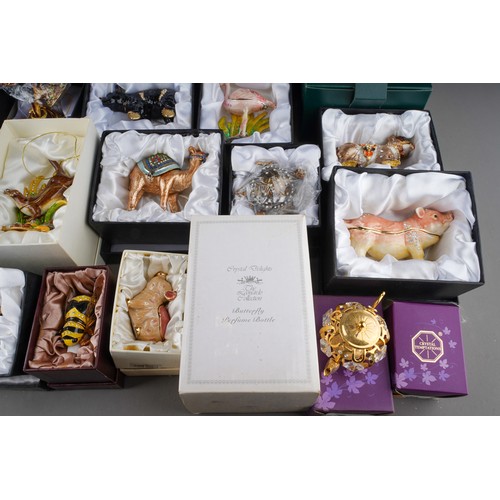 179 - A collection of boxed novelty enamelled gilt metal trinket boxes, including 