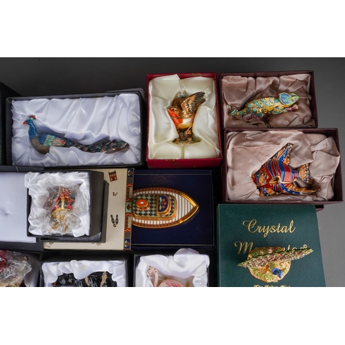 179 - A collection of boxed novelty enamelled gilt metal trinket boxes, including 