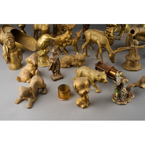 180 - A box of Victorian and 20th century brassware, including two pairs of candlesticks, models of deer, ... 