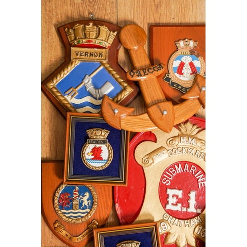 184 - A box containing eighteen items of Naval interest, including a quantity of Royal Navy ships crests o... 