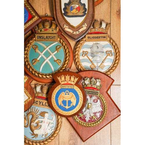 185 - A collection of eleven Royal Navy Ships crests of painted plaster and moulde in relief, including Fa... 