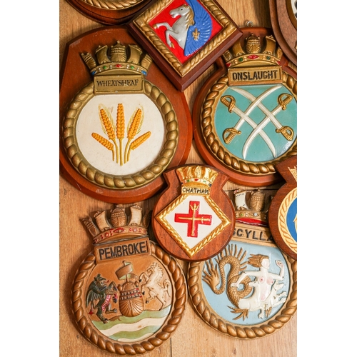 185 - A collection of eleven Royal Navy Ships crests of painted plaster and moulde in relief, including Fa... 