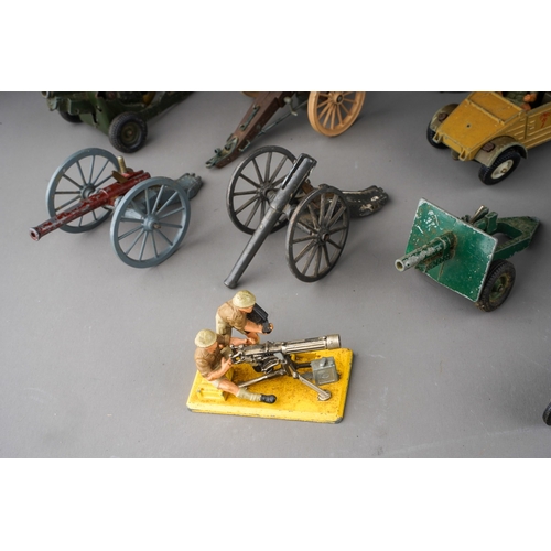 189 - A box of Britains die cast military vehicles, etc including 9720 anti-tank gun, 9704 25 pounder gun ... 