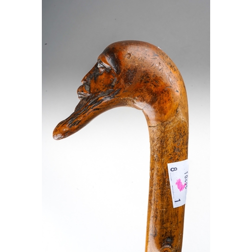 233 - A late 19th / early 20th century bearded face thorn walking stick, with glass eyes, length 82cm (2)