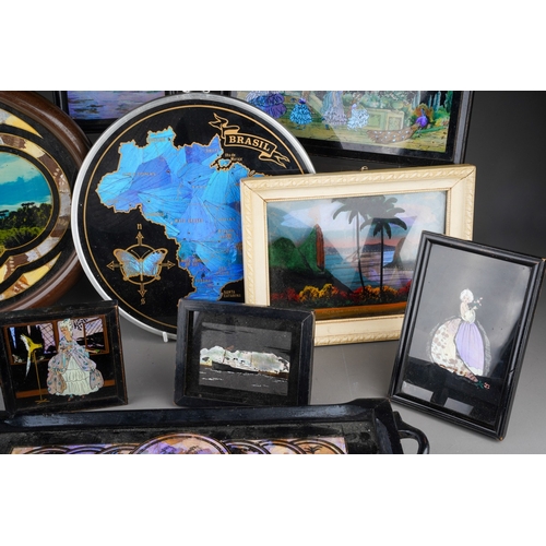 239 - A collection of butterfly wing trays, framed pictures and other souvenirs, etc, including a ship at ... 