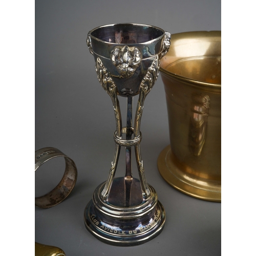 246 - A group of silver to include: napkin ring, cased spoon, two medals and a circular tortoiseshell clot... 