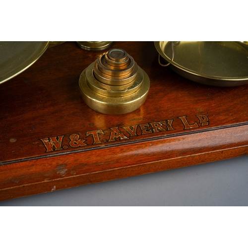 253 - An Edwardian Avery brass scales mounted with weights