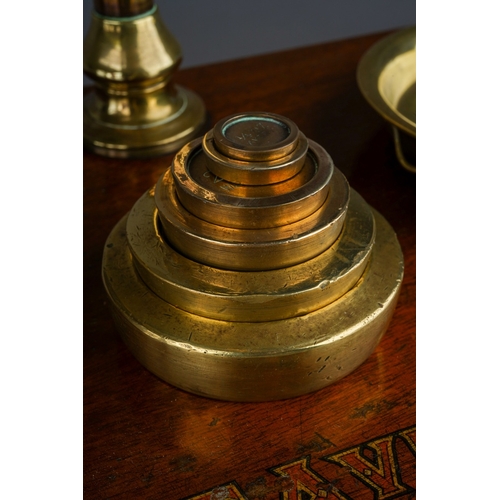 253 - An Edwardian Avery brass scales mounted with weights