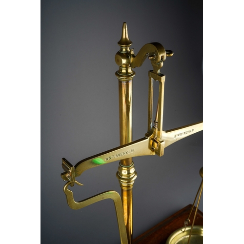 253 - An Edwardian Avery brass scales mounted with weights