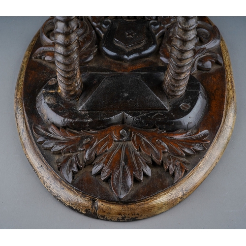 257 - A Scottish Victorian carved oak oval Armorial plaque mounted with rams horns