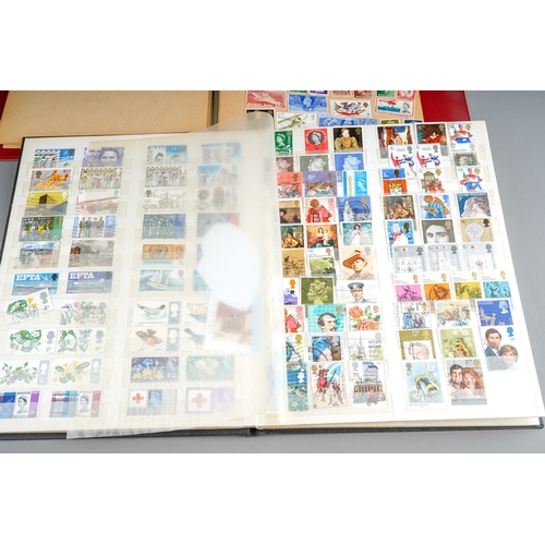 291 - A collection of QV to QE British and World stamps in four albums and loose, including a Boots stock ... 