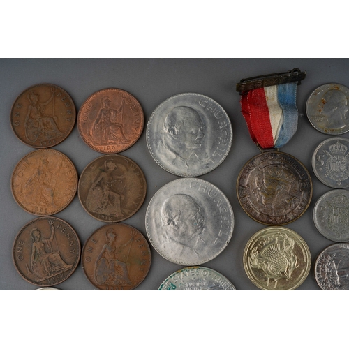 306 - A small collection of British and Foreign coins including two Churchill commemorative crowns, a 1972... 